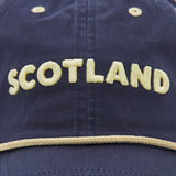 Show your support with the Scotland SRU 26/27 Dad Cap by Macron. Featuring "SCOTLAND" embroidered in bold yellow letters on the front above a striking yellow trim, this official navy blue cap blends stylish design with team spirit—an ideal accessory for any Scotland Rugby fan.