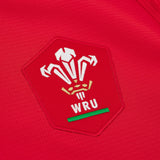 Close-up of the Welsh Rugby Union (WRU) logo embroidered on the Wales WRU 26/27 Authentic Matchday Home Jersey by Macron.
