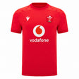 Experience the official Wales WRU 26/27 Authentic Matchday Home Jersey by Macron—crafted in striking red, it showcases a bold white Vodafone logo, white Macron branding, and a chest crest featuring the iconic white feather emblem with “WRU” text.