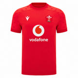 Experience the official Wales WRU 26/27 Authentic Matchday Home Jersey by Macron—crafted in striking red, it showcases a bold white Vodafone logo, white Macron branding, and a chest crest featuring the iconic white feather emblem with “WRU” text.
