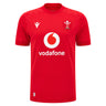 The Wales WRU 26/27 Replica Home Jersey by Macron is a red short-sleeve rugby shirt featuring the white Vodafone logo, WRU crest, and Macron branding on the front. Part of the official Macron 26/27 collection, this replica jersey is perfect for supporters looking to show their pride.