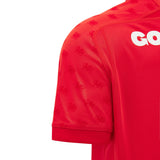 Close-up of the Wales WRU 26/27 Replica Home Jersey by Macron, highlighting the red sleeve adorned with repeating dragon motifs and partial white “GO” lettering on the chest, exemplifying the new home shirt design from Macron for the upcoming 2026/27 season.
