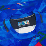 Close-up of the Italy 26/27 Home Authentic Jersey by Macron in blue, highlighting the collar with a visible Macron label, size details, and the phrase “LA POTENZA E LA VELOCITÀ” printed inside the neckline for an authentic touch.