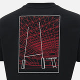 Back of a black Wales WRU 26/27 Goalpost Fan Cotton T-Shirt by Macron featuring a red and white line drawing of a stadium roof and rugby goalposts, with the Macron brand name visible.