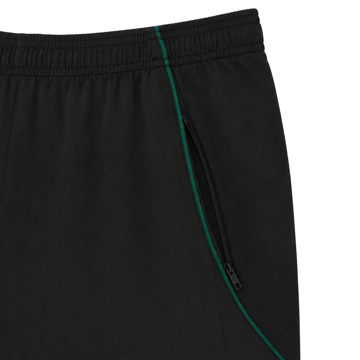 Close-up of the Wales WRU 26/27 Travel Training Shorts by Macron in black, showcasing an elastic waistband and a zippered pocket accented with a green line along the seam—evoking the streamlined design characteristic of Macron’s travel shorts.