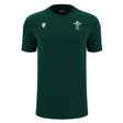 The Wales WRU 26/27 Travel Poly/Cotton T-Shirt by Macron is a plain dark green short-sleeve shirt featuring a white Macron logo on the right chest and the Welsh Rugby Union (WRU) emblem on the left chest, from the WRU travel collection.