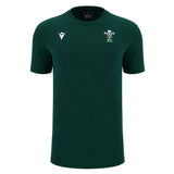 The Wales WRU 26/27 Travel Poly/Cotton T-Shirt by Macron is a plain dark green short-sleeve shirt featuring a white Macron logo on the right chest and the Welsh Rugby Union (WRU) emblem on the left chest, from the WRU travel collection.