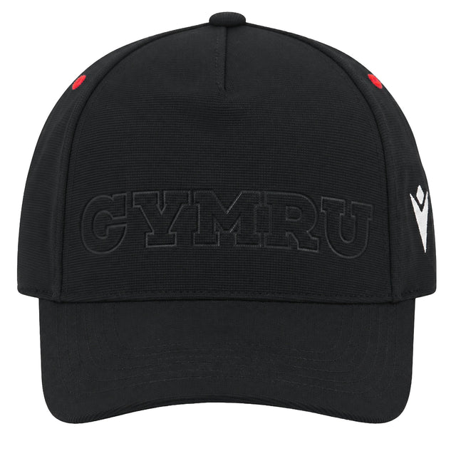 The Wales WRU 26/27 Baseball Cap by Macron is a black cap with raised black “CYMRU” text on the front, featuring a white Macron logo on the right side and two small red accents near the top seams.