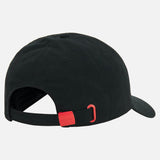 Back view of the black Wales WRU 26/27 Dad Cap by Macron, featuring an adjustable strap with a red buckle and a curved brim.