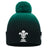 The Wales WRU 26/27 Pom-Pom Beanie by Macron features a green and black knit design with a pom-pom, showcasing the WRU logo in white on the front fold and an additional white logo on the side. This classic beanie by Macron is perfect for any Wales Rugby fan wanting to stay warm in style.