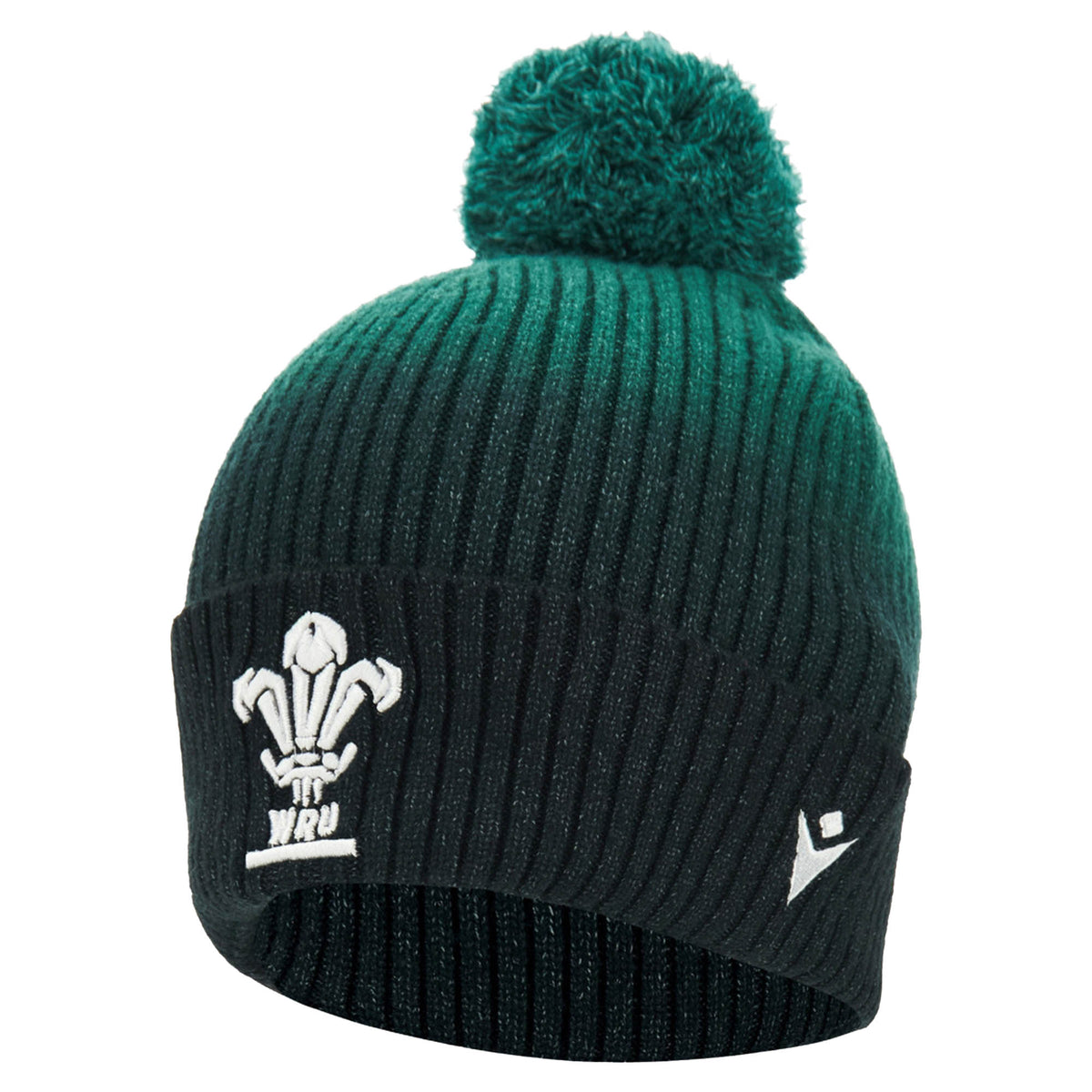 The Wales WRU 26/27 Pom-Pom Beanie by Macron is a ribbed knit green and black beanie featuring a pom-pom on top and embroidered white Macron logos on the front and side.