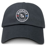 The Mudsock Rugby Adult Low-Profile Cotton Twill Dad Cap by EMB S&S Activewear features a black embroidered circular logo with “Mudsock Youth Rugby,” a rugby ball, and red/blue stripes—perfect for displaying team pride.