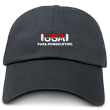 The EMB S&S Activewear USA Para Powerlifting Adult Low-Profile Cotton Twill Dad Cap is black with embroidered "USA PARA POWERLIFTING" and a barbell graphic on the front.
