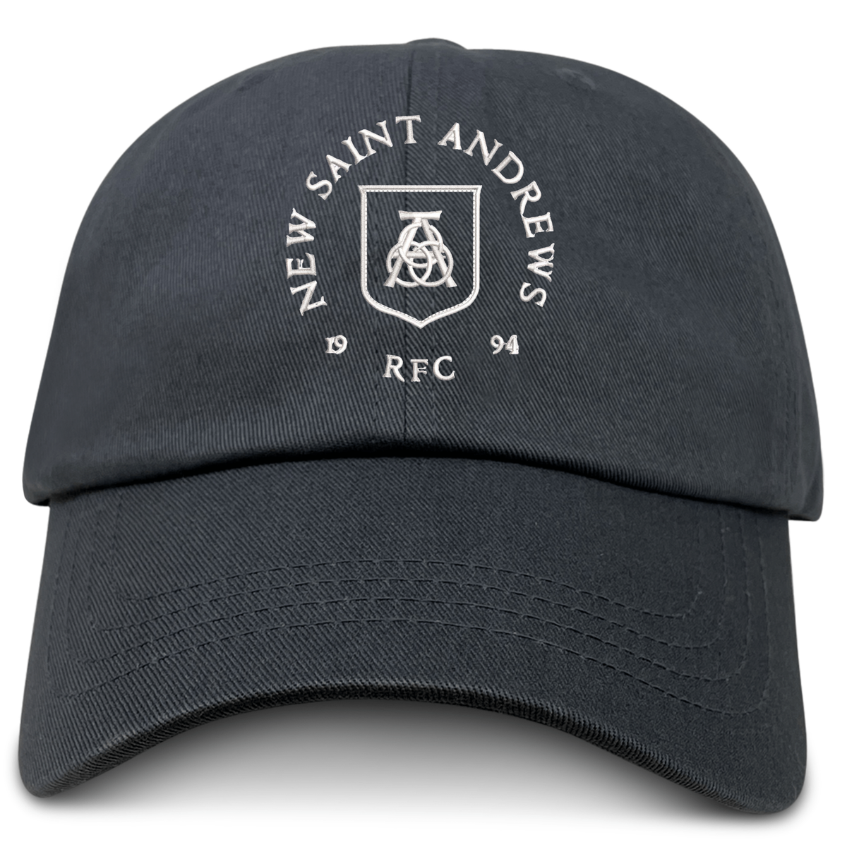 The EMB S&S Activewear New Saint Andrews College Adult Low-Profile Cotton Twill Dad Cap features a classic black cotton twill design with a white “New Saint Andrews RFC 1994” logo and crest embroidered on the front, making it the perfect timeless team hat for fans.