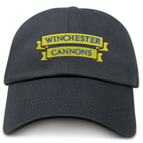 The EMB S&S Activewear Winchester Cannons Adult Low-Profile Cotton Twill Dad Cap is a black hat with a yellow banner and "WINCHESTER CANNONS" embroidered on the front.