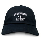 The Birmingham Rugby Text Logo Dad Cap by EMB S&S Activewear is a classic black cap featuring “Birmingham Rugby” and a small rugby graphic embroidered in white on the front—making it the perfect team hat for both fans and players.