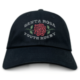 The EMB S&S Activewear Santa Rosa Youth Rugby Adult Low-Profile Cotton Twill Dad Cap features black cotton twill construction, a red rose, and “Santa Rosa Youth Rugby” embroidered team branding on the front.