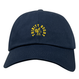 The EMB S&S Activewear Trinity College Adult Low-Profile Cotton Twill Dad Cap is navy blue with a yellow emblem and "Trinity Rugby" embroidered on the front.
