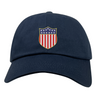The USA Rugby Original Olympic Dad Cap by EMB S&S Activewear features a shield with stars and red-white stripes—a stylish accessory for rugby fans.