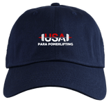 The USA Para Powerlifting Adult Low-Profile Cotton Twill Dad Cap by EMB S&S Activewear features “USA Para Powerlifting” and a barbell graphic in red and white on the navy blue front.