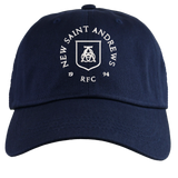 Introducing the New Saint Andrews College Adult Low-Profile Cotton Twill Dad Cap by EMB S&S Activewear: a navy blue hat featuring “New Saint Andrews RFC 1994” and a white embroidered crest on the front, combining classic team style with a timeless dad cap design.