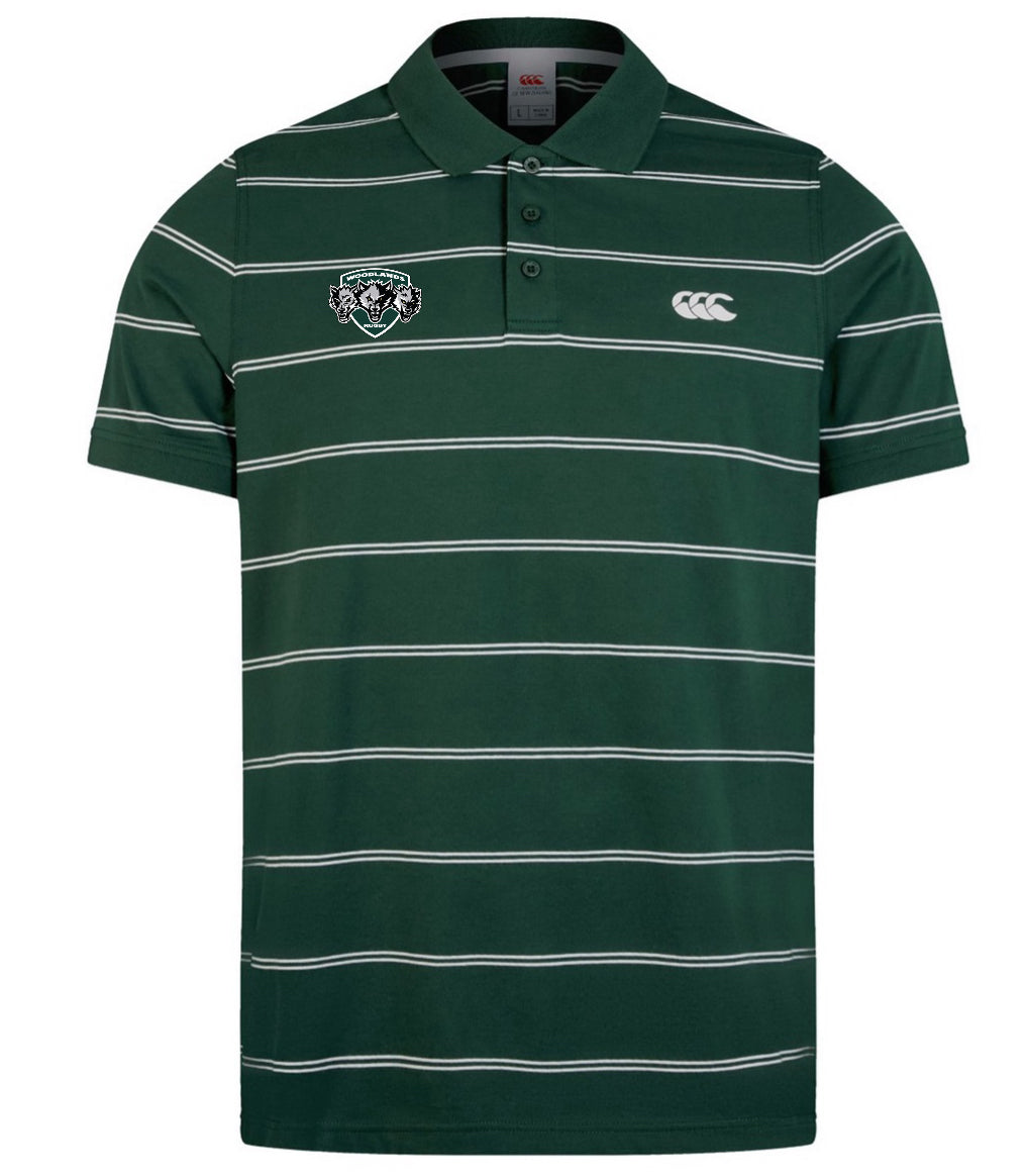 The Woodlands Youth Wolfpack Fundamental Yarn-Dye Stripe Polo by EMB Canterbury features green and white horizontal stripes, two chest embroidered logos, and a classic three-button placket.