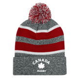 A striped red, white, and grey acrylic fabric Nations of Rugby Canada Hooped Pom-Pom Beanie with "Canadian rugby" logo by EMB Augusta.