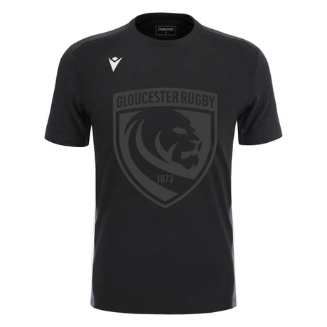 The Gloucester 25/26 Cotton Travel T-Shirt by Macron is black with a large dark grey lion crest and "1873" on the front, plus a white Macron logo on the right shoulder.
