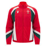 The Wales WRU 26/27 Heritage Retro Jacket by Macron is a red zip-up jacket with green and white accents, featuring the Welsh Rugby Union logo on the left chest and the Macron logo on the right, showcasing classic heritage rugby style from Macron.