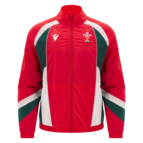 Introducing the Wales 26/27 Heritage Retro Jacket by Macron: a red and green zip-up sports jacket with white accents, featuring the Welsh Rugby Union logo on the left chest and the Macron brand logo on the right. This jacket seamlessly blends classic style and modern comfort, making it the perfect retro rugby piece for any dedicated fan.