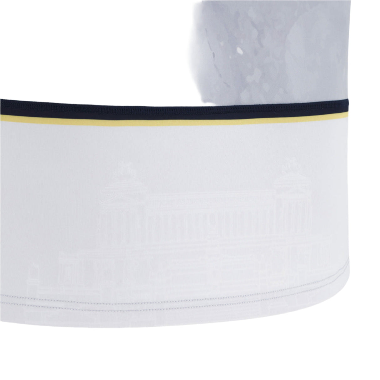 Close-up of a white fabric band from the Italy 25/26 Replica Away Jersey by Macron, showing a dark and gold stripe at the top and a faint architectural pattern.