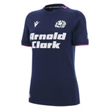 Women's Scotland 25/26 Replica Home Jersey by Macron features navy blue short sleeves, a white "Arnold Clark" sponsor logo, Scottish Rugby crest, and pink collar trim.