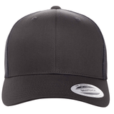The S&S Activewear Retro Trucker Cap is black with an embroidered design, mesh back, and a brim sticker showing product details.
