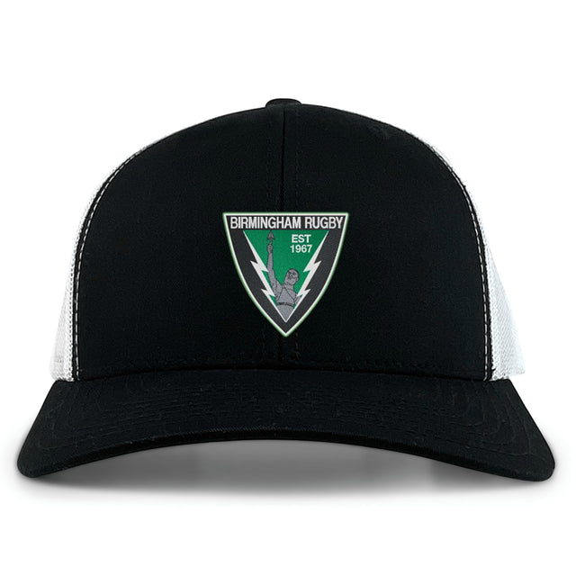 The Birmingham Rugby Retro Trucker Cap by EMB S&S Activewear is a black and white snapback featuring the team logo with a lightning bolt, torch, and "Est 1967" embroidered on the front.