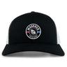 The Mudsock Rugby Retro Trucker Cap by EMB S&S Activewear features a black and white design, circular “Mudsock Youth Rugby” embroidery with a rugby ball and red-blue stripes, plus an adjustable snapback closure.