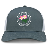 The Society of Iowa Rugby Referees Retro Trucker Cap by EMB S&S Activewear showcases a gray and white design with a round “Society of Iowa Rugby Referees” patch, adorned with pink embroidered flowers and green leaves on the front panel, and finished with an adjustable snapback closure.