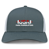 The EMB S&S Activewear USA Para Powerlifting Retro Trucker Cap features gray and white panels, embroidered "USA Para Powerlifting" text, a red and white barbell graphic on the front, and a snapback closure for adjustable fit.