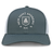 The New Saint Andrews College Retro Trucker Cap by EMB S&S Activewear features a gray and white design with “New Saint Andrews REC 1994” and a white crest logo printed on the front panel, finished with a classic snapback closure for an adjustable fit.