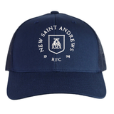 Introducing the New Saint Andrews College Retro Trucker Cap by EMB S&S Activewear. This navy blue cap features a classic mesh back and showcases an embroidered white New Saint Andrews RFC logo with “1994” printed on the front panel. The adjustable snapback closure ensures a comfortable fit.