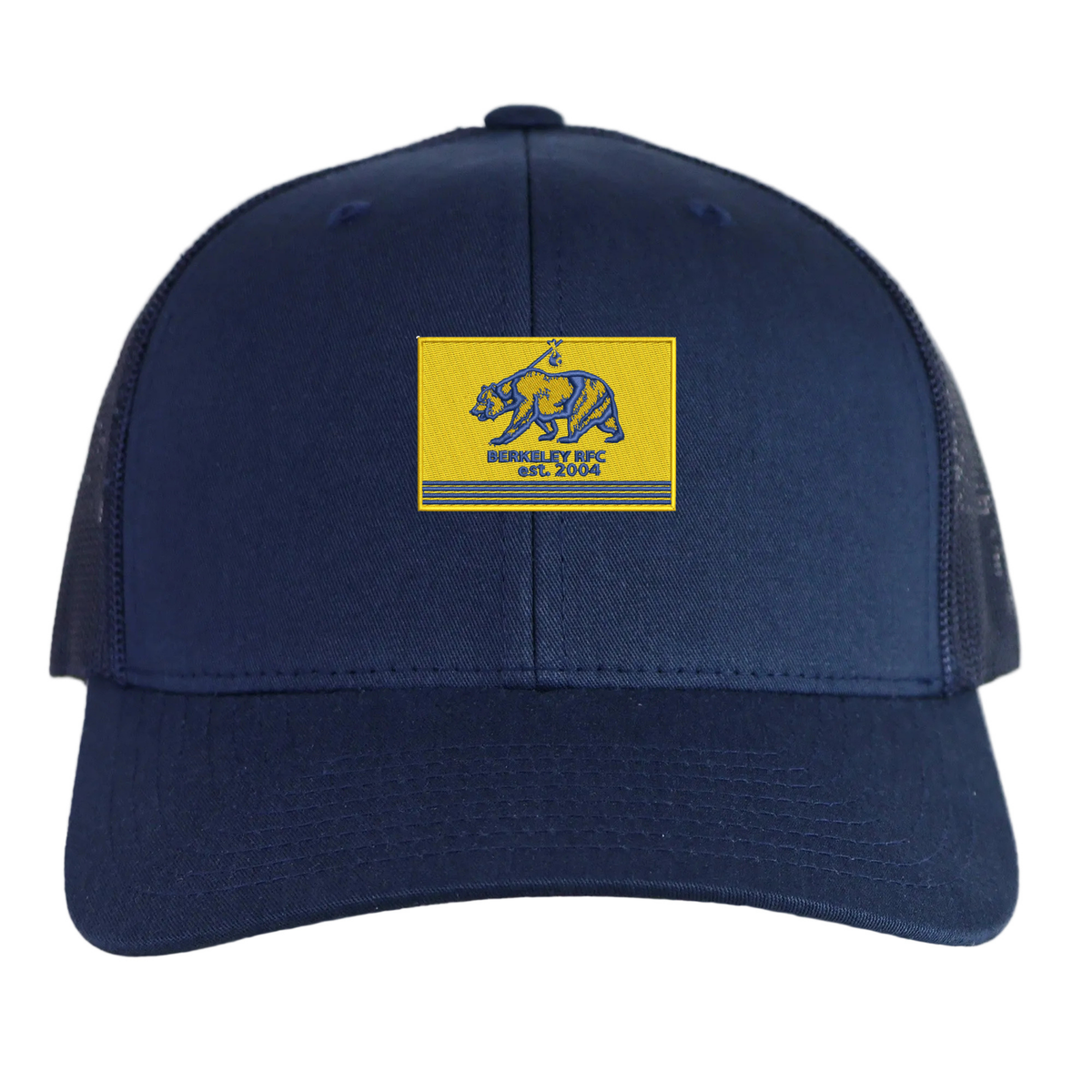 Navy blue Berkeley RFC Retro Trucker Cap with a rectangular patch featuring a bear, a spear, and the embroidered text “BERKELEY RFC est. 2004.”
