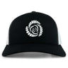 The Missoula All-Maggots Retro Trucker Cap by EMB S&S Activewear is a black and white trucker cap with an embroidered spiral seashell design in white on the front panel, featuring an adjustable snapback closure for a comfortable fit.