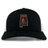 An Aging Alabama Rugby Players Retro Trucker Cap featuring an embroidered design of the state of Alabama containing a figure with a scythe and the text “HARD.”.
