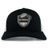 ICRON Retro Trucker Cap in black and white with an embroidered design featuring a shield, a football, and the text “ICRON.”