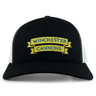 The Winchester Cannons Retro Trucker Cap by EMB S&S Activewear features a black and white design, yellow and blue embroidered front logo, and an adjustable snapback closure.