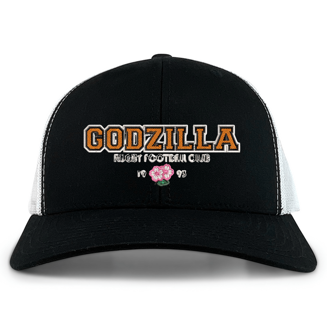 Introducing the Godzilla Rugby Football Club Retro Trucker Cap by EMB S&S Activewear—a black and white hat featuring “GODZILLA RUGBY FOOTBALL CLUB” embroidered on the front, a bold pink flower, “1993,” and a classic adjustable snapback closure for an ideal fit.