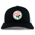 The Society of Iowa Rugby Referees Retro Trucker Cap by EMB S&S Activewear features a black and white design with a circular patch that reads “Society of Iowa Rugby Referees” and showcases a floral graphic in the center. This classic cap is finished with embroidered detailing and an adjustable snapback closure for a comfortable fit.