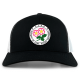 The Society of Iowa Rugby Referees Retro Trucker Cap by EMB S&S Activewear features a black and white design with a circular patch that reads “Society of Iowa Rugby Referees” and showcases a floral graphic in the center. This classic cap is finished with embroidered detailing and an adjustable snapback closure for a comfortable fit.