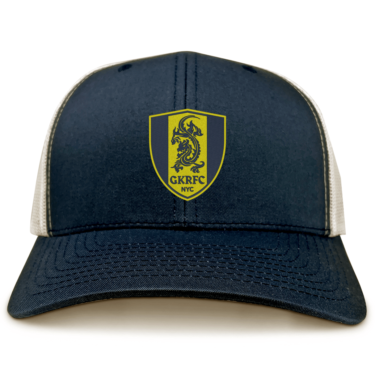 The Gotham Knights Retro Trucker Cap by EMB S&S Activewear is a navy and white hat with a yellow shield logo, embroidered dragon, "GKRFC NYC" text on the front, and a classic snapback closure.