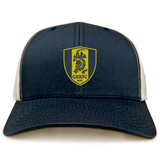 The Gotham Knights Retro Trucker Cap by EMB S&S Activewear is a navy and white hat with a yellow shield logo, embroidered dragon, "GKRFC NYC" text on the front, and a classic snapback closure.
