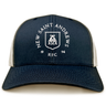 The New Saint Andrews College Retro Trucker Cap by EMB S&S Activewear is a navy blue and white hat featuring an embroidered “New Saint Andrews RFC 1994” shield logo on the front, complete with a comfortable snapback closure.